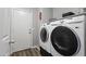 Bright laundry room featuring a modern, front-load washer and dryer set for efficient laundry care at 10442 W Toronto Way, Tolleson, AZ 85353