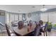 Well-appointed living room and dining area featuring sophisticated decor and hardwood floors at 10442 W Toronto Way, Tolleson, AZ 85353