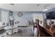 Comfortable living room with stylish furniture, decorative accents, and ample natural light at 10442 W Toronto Way, Tolleson, AZ 85353