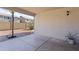 Covered patio perfect for entertaining, featuring a smooth concrete floor and outdoor lighting at 10442 W Toronto Way, Tolleson, AZ 85353