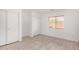Neutral bedroom with modern tile flooring, ample closet space, and bright natural light at 12132 W Dahlia Dr, El Mirage, AZ 85335