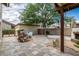Paver backyard with BBQ, flowers, a fireplace, and a storage shed at 122 W Cottage Ln, Tempe, AZ 85282