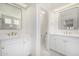 Elegant bathroom with dual vanities, sleek mirrors, and gold fixtures, providing a sophisticated and functional space at 122 W Cottage Ln, Tempe, AZ 85282