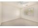 Bright bedroom with neutral carpet and a window with bright white shutters at 122 W Cottage Ln, Tempe, AZ 85282