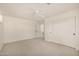 Neutral carpeted bedroom with bright white ceiling fan and sliding closet doors at 122 W Cottage Ln, Tempe, AZ 85282