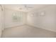 Neutral carpeted bedroom with bright white ceiling fan and shutters at 122 W Cottage Ln, Tempe, AZ 85282