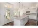 Bright kitchen with white cabinets, granite countertops, and a stainless steel sink and appliances at 122 W Cottage Ln, Tempe, AZ 85282