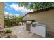 Backyard features an outdoor kitchen with stainless steel grill, counter space, and convenient access to the home at 122 W Cottage Ln, Tempe, AZ 85282