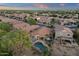 Beautiful aerial shot of homes and community landscaping highlighting a backyard swimming pool and patio at 20848 E Desert Hills Blvd, Queen Creek, AZ 85142