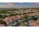 Aerial view of homes on landscaped streets, featuring desert-style landscaping and mountain backdrop at 20848 E Desert Hills Blvd, Queen Creek, AZ 85142