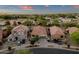 High-angle shot capturing a suburban neighborhood with various homes, tidy yards, and symmetrical street patterns at 20848 E Desert Hills Blvd, Queen Creek, AZ 85142