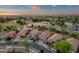 Elevated view of a well-planned residential community boasting tree-lined streets and diverse home styles at 20848 E Desert Hills Blvd, Queen Creek, AZ 85142