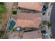 Aerial view of the home with an outdoor pool and backyard entertaining area, including a lounge and patio at 20848 E Desert Hills Blvd, Queen Creek, AZ 85142