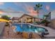 Stunning backyard pool with lush landscaping, creating a private and serene oasis for relaxation and enjoyment at 20848 E Desert Hills Blvd, Queen Creek, AZ 85142