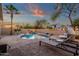 Relaxing backyard featuring a sparkling pool, lounge chairs, and lush greenery, ideal for leisure and entertaining at 20848 E Desert Hills Blvd, Queen Creek, AZ 85142