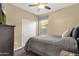 Charming bedroom with closet, ceiling fan, and cozy furnishings for a comfortable living space at 20848 E Desert Hills Blvd, Queen Creek, AZ 85142
