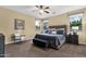 Spacious primary bedroom with neutral color palette and ample natural light from multiple windows at 20848 E Desert Hills Blvd, Queen Creek, AZ 85142