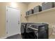 Convenient laundry room equipped with modern washer and dryer for efficient chores at 20848 E Desert Hills Blvd, Queen Creek, AZ 85142
