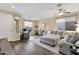 Bright, open living room with a large sectional sofa and ample natural light, creating a welcoming space at 20848 E Desert Hills Blvd, Queen Creek, AZ 85142
