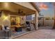 Outdoor patio featuring comfortable seating, fire pit, and a serene ambiance for entertaining and relaxation at 20848 E Desert Hills Blvd, Queen Creek, AZ 85142