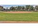Community baseball field with a well-maintained diamond and outfield, perfect for sports enthusiasts at 26232 N 121St Ln, Peoria, AZ 85383