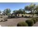 Scenic view of community park with playground, picnic tables, and open green space at 26232 N 121St Ln, Peoria, AZ 85383