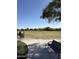 Community park featuring a green space, seating, and playground equipment at 26232 N 121St Ln, Peoria, AZ 85383