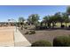 Community park featuring a playground, basketball court, and covered picnic tables at 26232 N 121St Ln, Peoria, AZ 85383