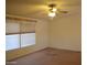 Bedroom featuring a window, carpet, and ceiling fan at 2650 W Union Hills Dr # 43, Phoenix, AZ 85027