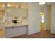 A spacious kitchen with an eat in bar adjacent to the living room at 2650 W Union Hills Dr # 43, Phoenix, AZ 85027