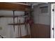 Functional storage room featuring pegboard walls, shelving, and window AC unit at 2650 W Union Hills Dr # 43, Phoenix, AZ 85027