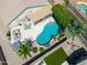 Inviting backyard with a refreshing pool, relaxing hot tub, covered patio, and meticulously kept landscaping at 343 S Cottonwood St, Chandler, AZ 85225