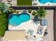 Stunning backyard oasis offering a resort-style pool, hot tub, patio furniture, and lush landscaping at 343 S Cottonwood St, Chandler, AZ 85225