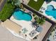 Backyard paradise featuring a luxurious pool, spa, outdoor seating, and a low-maintenance artificial lawn at 343 S Cottonwood St, Chandler, AZ 85225