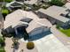 Charming single-story home showcasing a nicely landscaped front yard and long driveway to the three-car garage at 343 S Cottonwood St, Chandler, AZ 85225