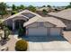 Inviting single-story home featuring a well-manicured front yard and a spacious three-car garage at 343 S Cottonwood St, Chandler, AZ 85225