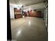 Bright garage with epoxy flooring and built-in wood storage cabinets on all walls at 343 S Cottonwood St, Chandler, AZ 85225