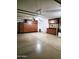 Spacious garage with epoxy flooring and extensive built in cabinets and storage solutions at 343 S Cottonwood St, Chandler, AZ 85225
