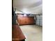 Garage with epoxy flooring, built-in cabinets and overhead garage door mechanism at 343 S Cottonwood St, Chandler, AZ 85225