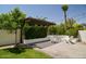 Inviting backyard with a pergola, seating, and lush landscaping, perfect for outdoor relaxation at 4454 S Lariat Ct, Gilbert, AZ 85297