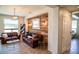 Cozy living room featuring a wooden accent wall and comfortable seating at 4454 S Lariat Ct, Gilbert, AZ 85297