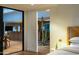 An interior view from the bedroom into the kitchen with an opening featuring a desert cactus at 5311 E Mitchell Dr, Phoenix, AZ 85018