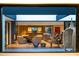 A view from a doorway of the living room with modern decor and a view of the kitchen at 5311 E Mitchell Dr, Phoenix, AZ 85018