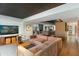 A modern living room featuring a comfortable sectional sofa, artwork, and an open floor plan at 5311 E Mitchell Dr, Phoenix, AZ 85018