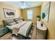 Cozy bedroom featuring a ceiling fan, window, and stylish decor, creating a relaxing atmosphere at 5743 W Gwen St, Laveen, AZ 85339