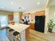 Bright kitchen features an island with bar seating, modern appliances, and lots of cabinet space at 5743 W Gwen St, Laveen, AZ 85339