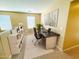 Bright office featuring modern desk, shelving, and natural light, creating an ideal workspace at 5743 W Gwen St, Laveen, AZ 85339
