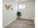 Bright, open room with light-colored hardwood flooring and a neutral color scheme at 6607 S Mitchell Dr, Tempe, AZ 85283