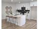 Stylish kitchen featuring a central island with barstool seating and modern appliances at 6607 S Mitchell Dr, Tempe, AZ 85283