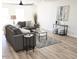 Cozy living room with comfortable seating, a decorative rug, and modern accents at 6607 S Mitchell Dr, Tempe, AZ 85283
